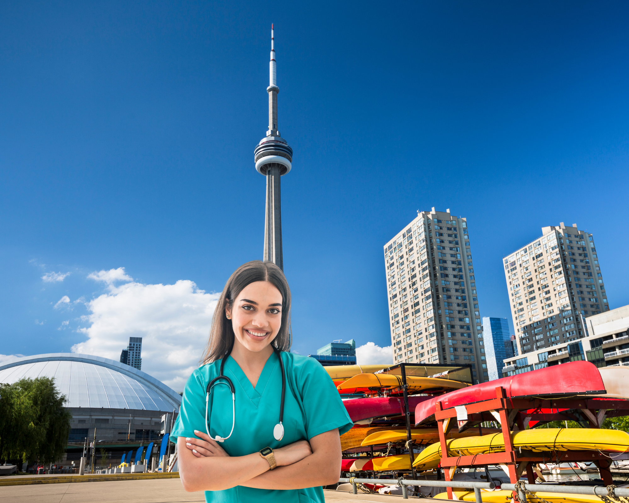 A smiling travel nurse with a backdrop of the CN tower in Toronto